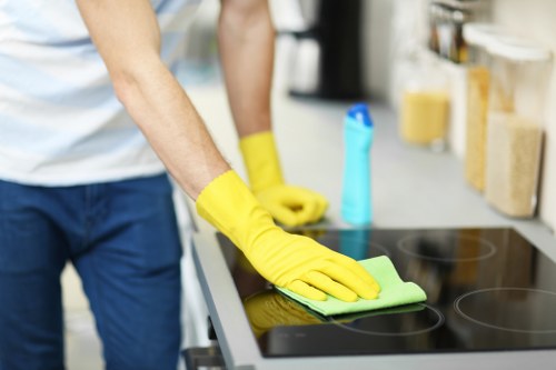 Team member using safe cleaning methods and checking equipment