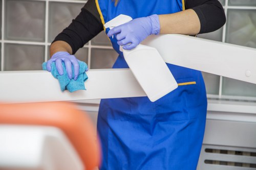 Staff using protective equipment during cleaning